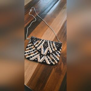 Elegant Black and Gold Sequin Clutch